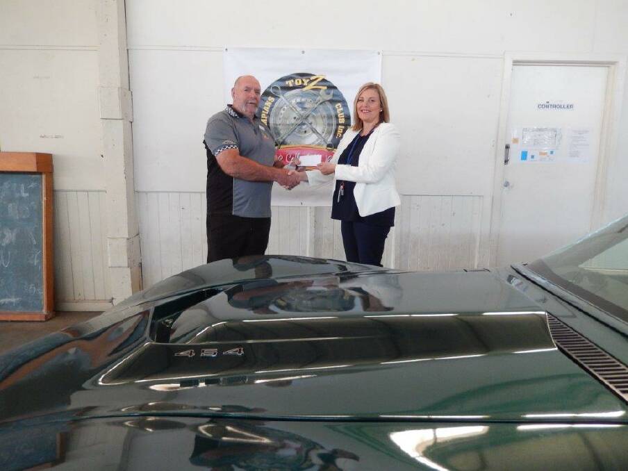Grampians Toy Club's Kevin Damon hands the cheque of $550 over to Stawell Region Hospital acting CEO Libby Fifis.