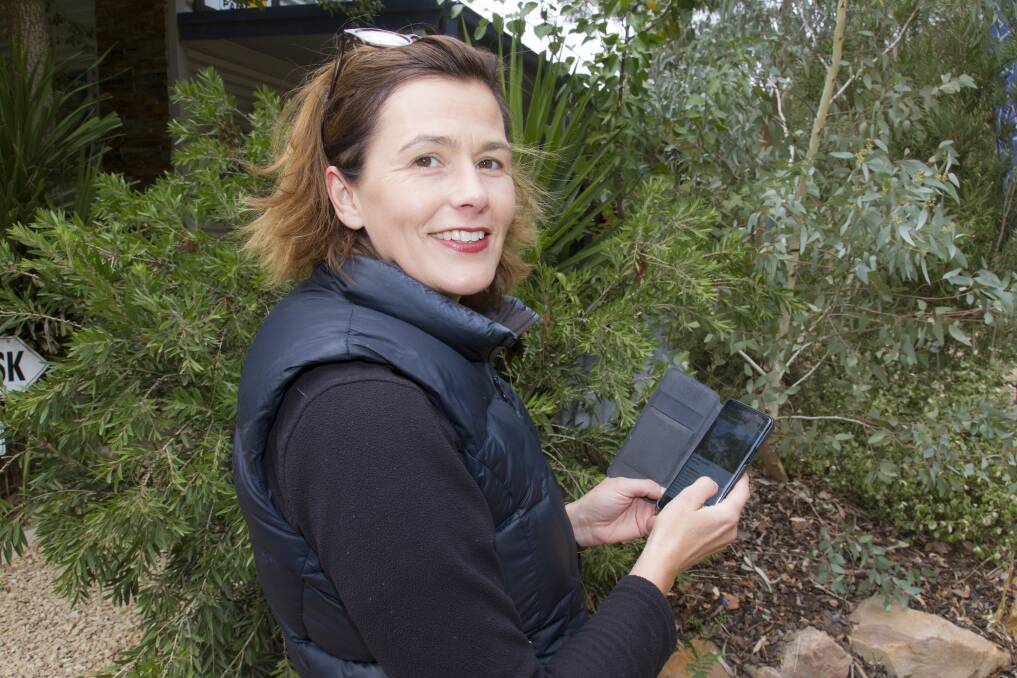Josephina McDonald tries out her new app. Picture: PETER PICKERING