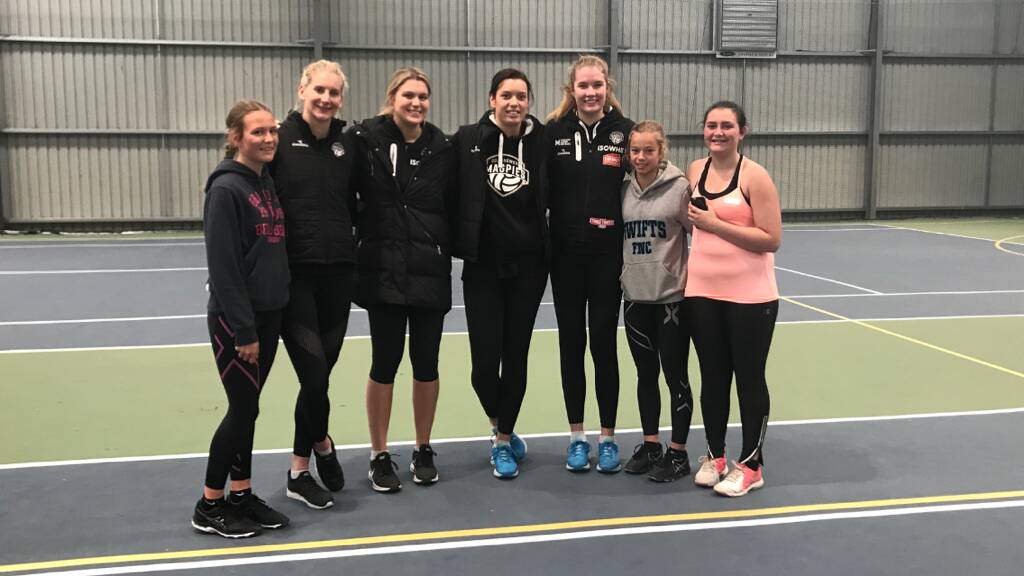 IDOLS: Swifts players with their Collingwood netball heroes at the clinic at Horsham Lanes and Games. 