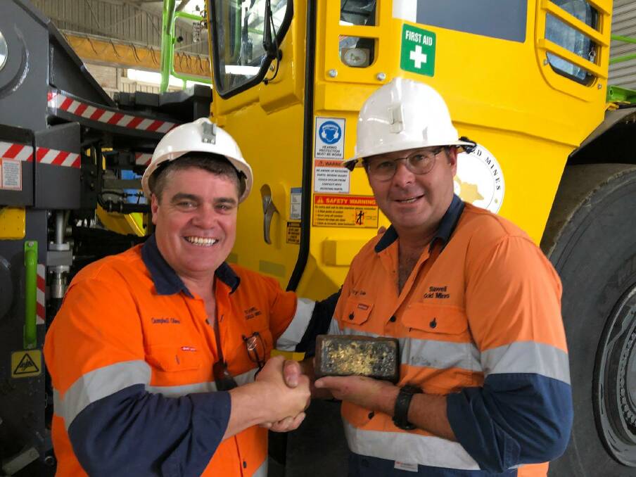 Stawell Gold Mine chief executive Campbell Olsen general manager Troy Cole with the first gold bar after reopening the mine. Picture: STAWELL GOLD MINES FACEBOOK