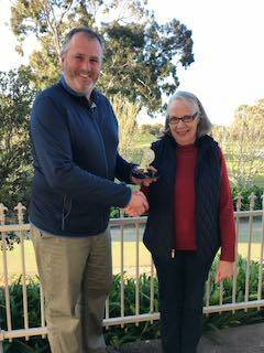 Richard Hackwill presents Linda Maher with her hole-in-one award