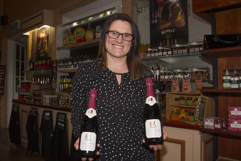 POSITIVE: Seppelt Wines cellar manager Deb Riley with their latest award winning shiraz. Seppelt Wines in the naming sponsor of Stakes Day this year. Picture: Peter Pickering.