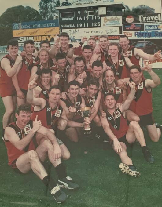 SWEET SUCCESS: Stawell Warriors celebrate their first senior premiership as a merged club in 2000. They beat Ararat by 10 points to win the flag.