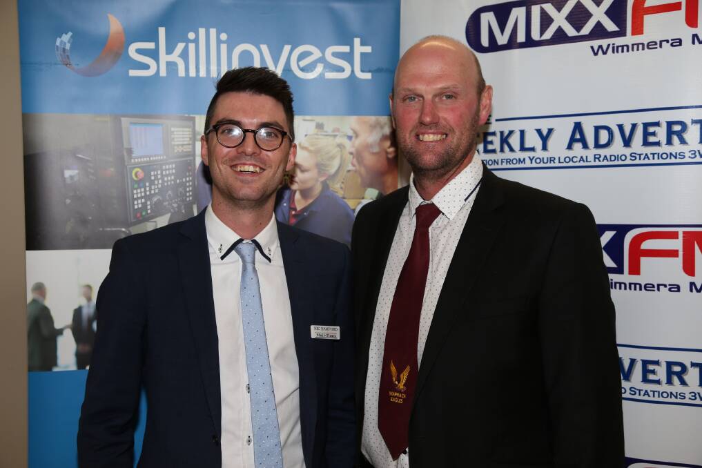 Wimmera Mail-Times representative Nic Banford and Warrack Eagles president Adrian Bibby, representing Wimmera Mail-Times champion player Nick Peters 