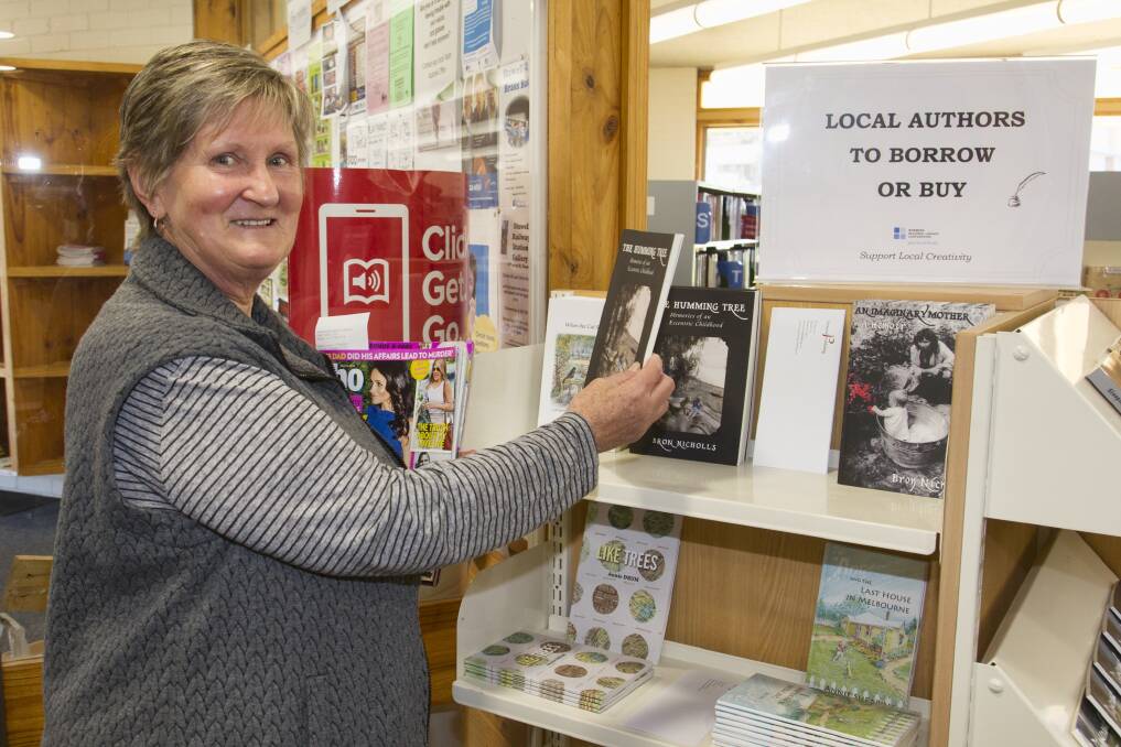Bev Woolley checks out some of the local work at the Stawell Library. Picture: PETER PICKERING