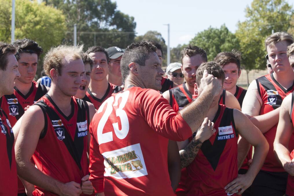 Damian Joiner addresses his team in a pre-season practice match. Picture: PETER PICKERING