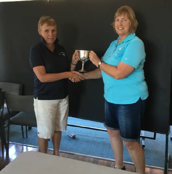 Joan Fletcher (left) receives the Allanvale Cup won by Stawell on Wednesday.