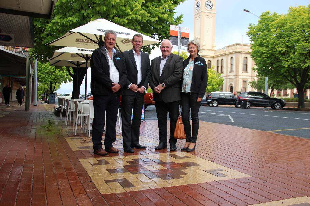 EXPANSION: Cr Murray Emerson, Member for Wannon Dan Tehan and Crs Kevin Erwin and Karen Hyslop on a new stretch of pavement on Main Street in Stawell. Picture: LACHLAN WILLIAMS