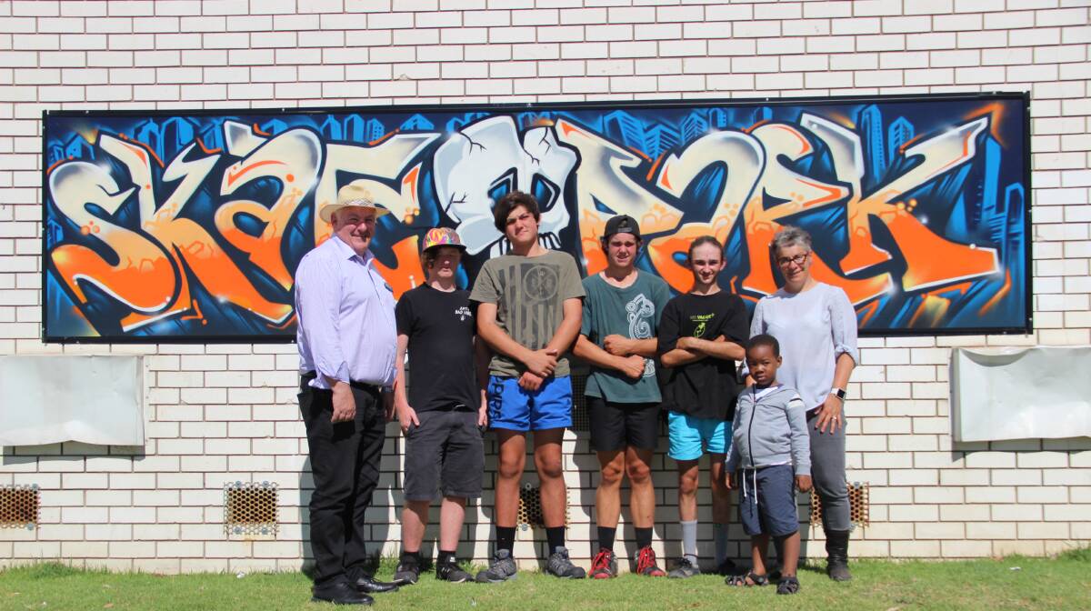 NEW PIECE: Cr Kevin Erwin (far left) with some community members at the unveiling of the new mural at the Stawell Skate Park. The mural is part of a crime prevention program. Picture: LACHLAN WILLIAMS