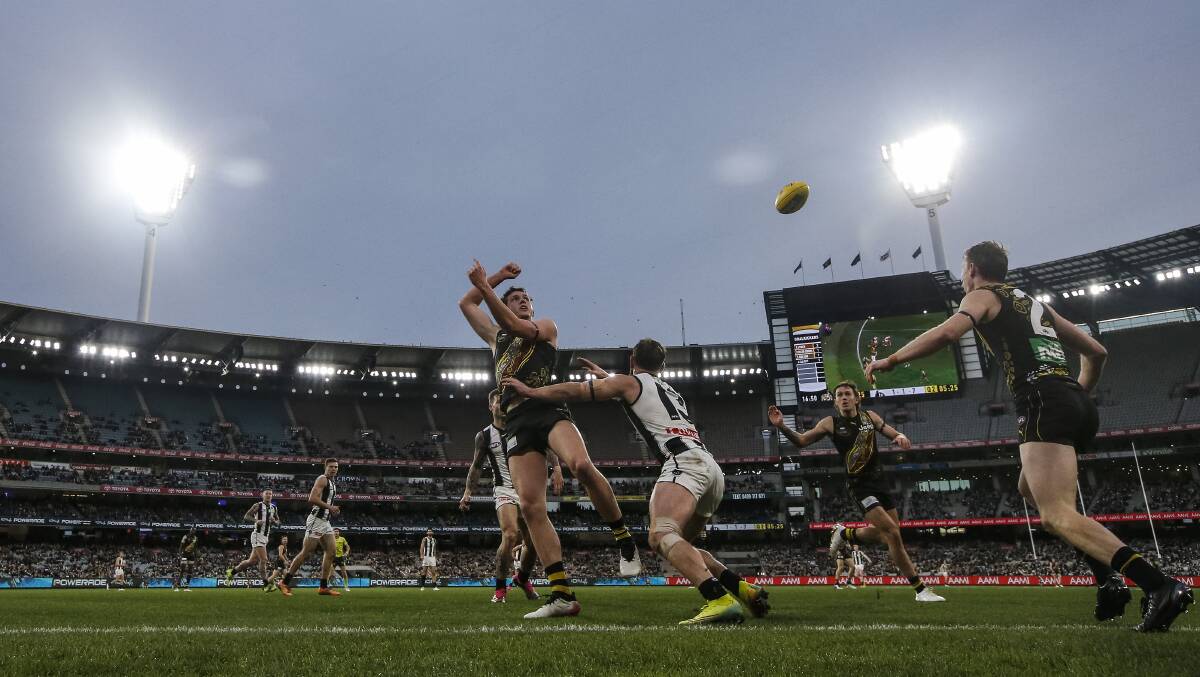 Half-empty grandstands have become a common sight in today's AFL, with fans staying away in droves. Photo: Darrian Traynor/Getty Images