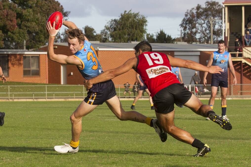 Ed Pritchard evades a tackle against Stawell in 2018. Pritchard will return to Nhill for the 2020 season. Picture: PETER PICKERING