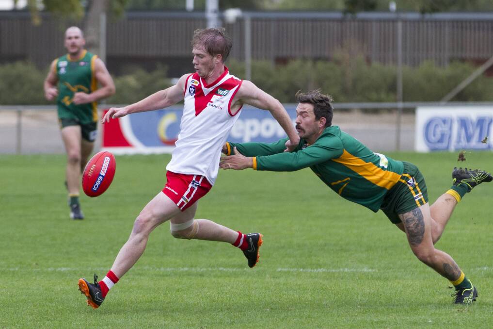 Callum Mendes gets a kick away against Dimboola. Picture: PETER PICKERING