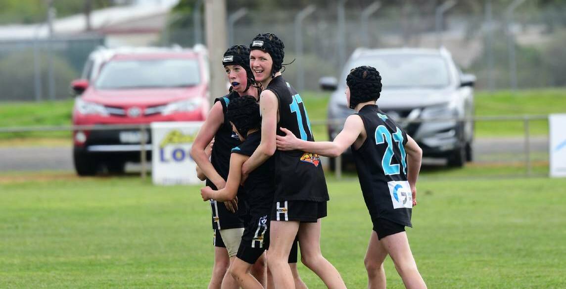 UNITED: Players from the Swifts' under-14s team celebrate earlier this season. Swifts finished the season as minor premiers. Picture: KARL MEYER