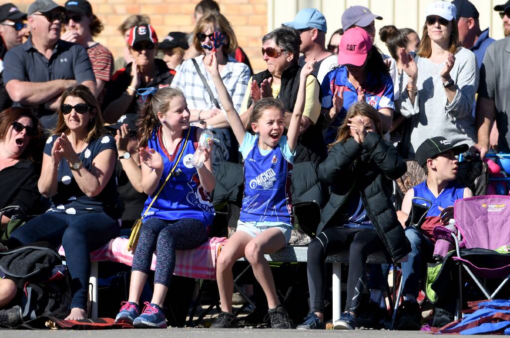 A young Horsham supporter cheers on the Demons during last season's Wimmera netball league grand final. Picture: SAMANTHA CAMARRI