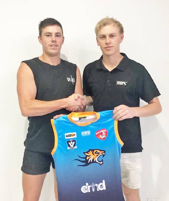 Eric Brereton is welcomed to Nhill by new assistant coach and former North Adelaide teammate Frazer Driscoll. Picture: CONTRIBUTED