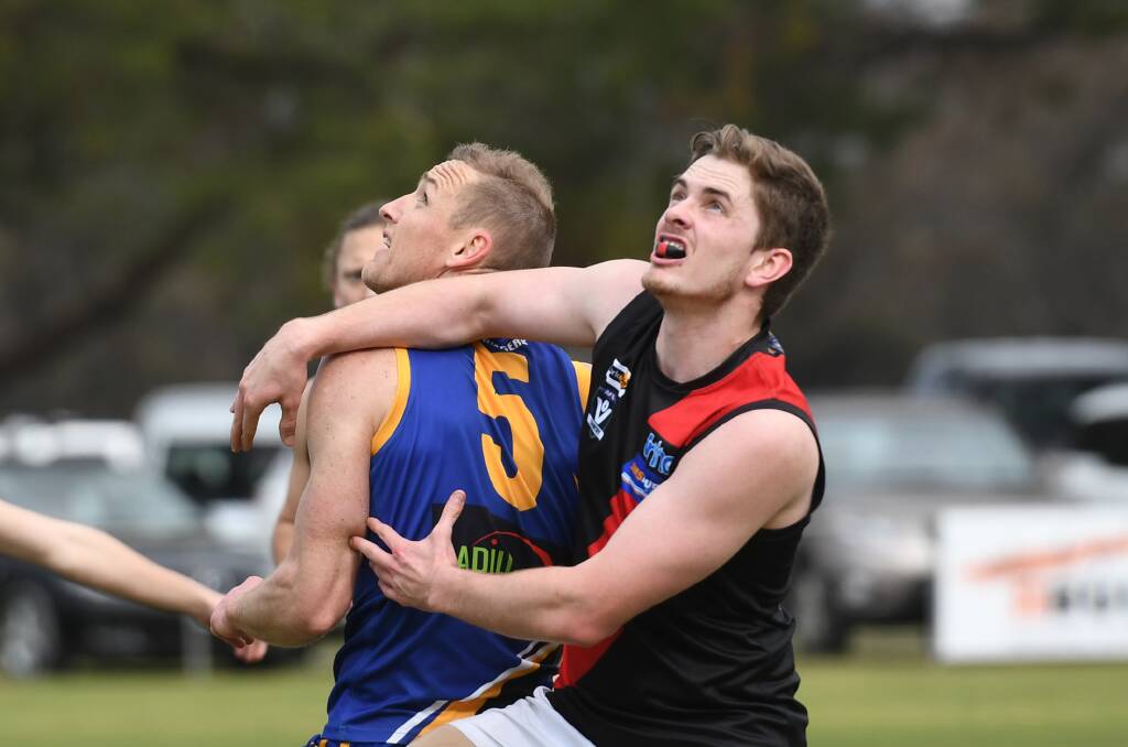 Natimuk United's Sam Anson jostles for best position with Noradjuha-Quantong's Jack Vague in the preliminary final. Picture: SAMANTHA CAMARRI