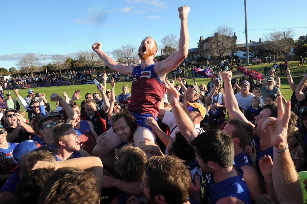 Burke celebrates after the 2014 grand final. 