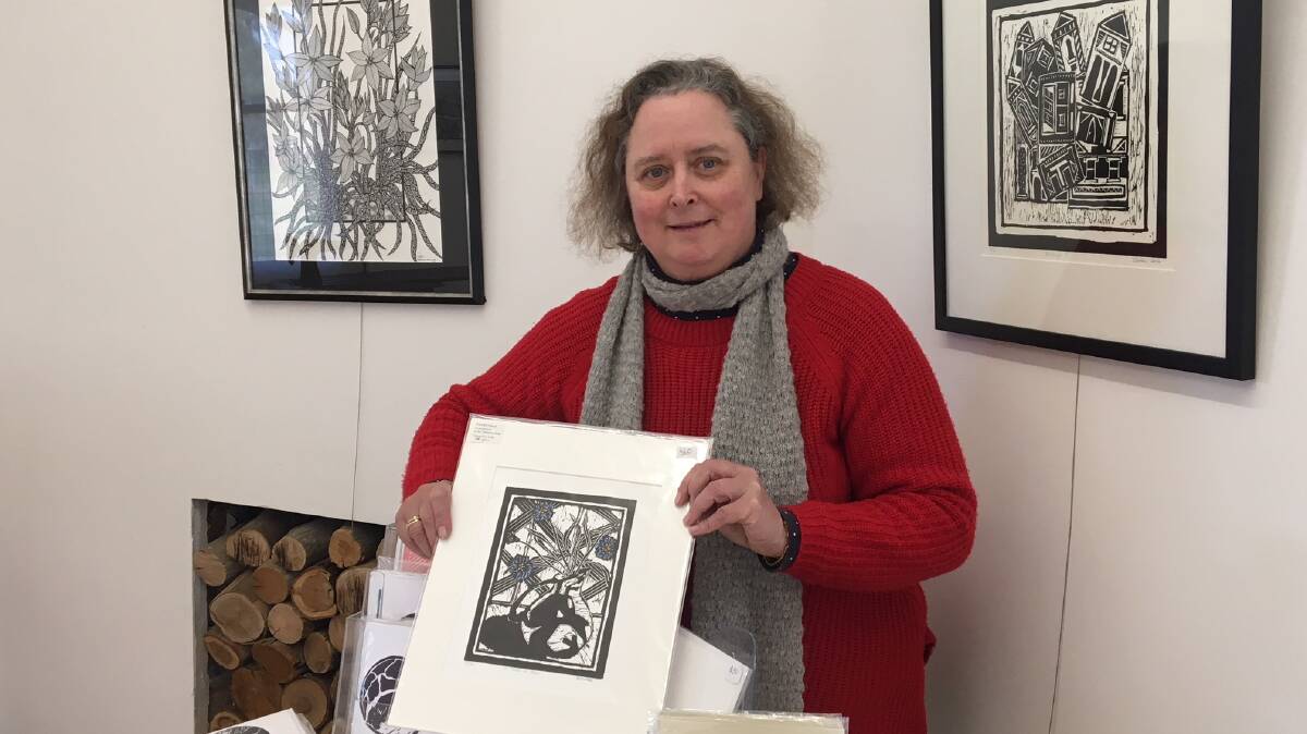 TALENT: Printmaker Susan Clarke prepares work for Sunday's exhibition opening at Willaura. Picture: CONTRIBUTED 