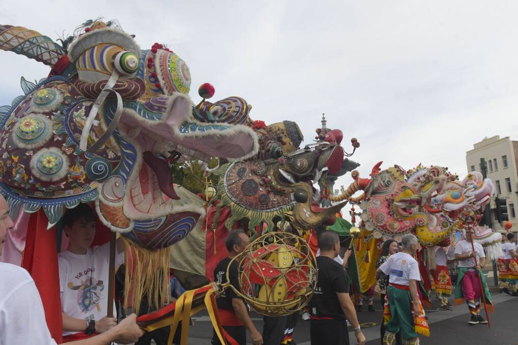 More than 150 people carry the Chinese dragon's during Bendigo's Easter parade. Photo: Glenn Daniels