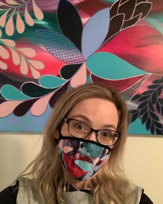 STYLISH: Rebecca Warr wearing a face mask featuring her artwork. Picture: Supplied