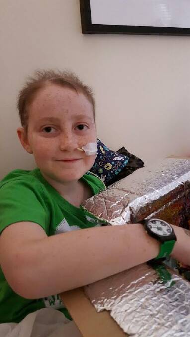 HAPPY BIRTHDAY: Rylan Smith opens a present at his ten year birthday celebrations at the weekend.