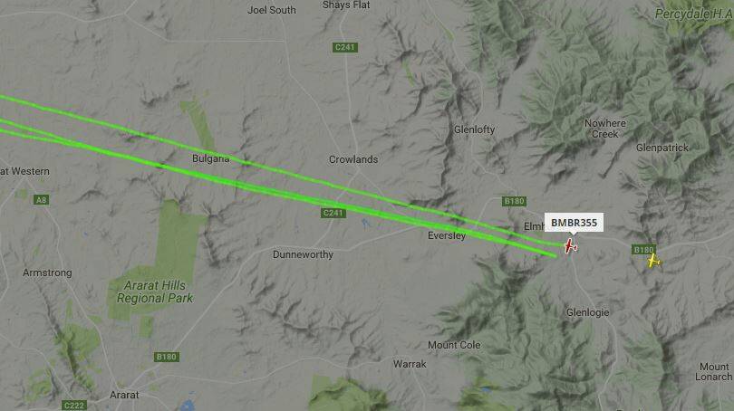 A water bomber and spotting aircraft from Stawell fight a fire near Elmhurst. Picture: FLIGHTRADAR24.COM