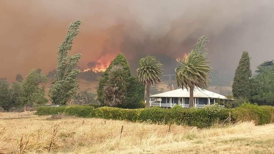 The Dunns Road fire looms over a property outside Tumbarumba on December 31, 2019.