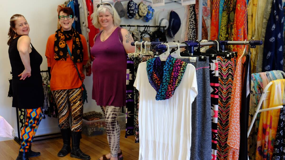 MARKET: Jodi Matthews and Alison Bainbridge help a regular customer with their leggings at last month's Pomonal Market. 