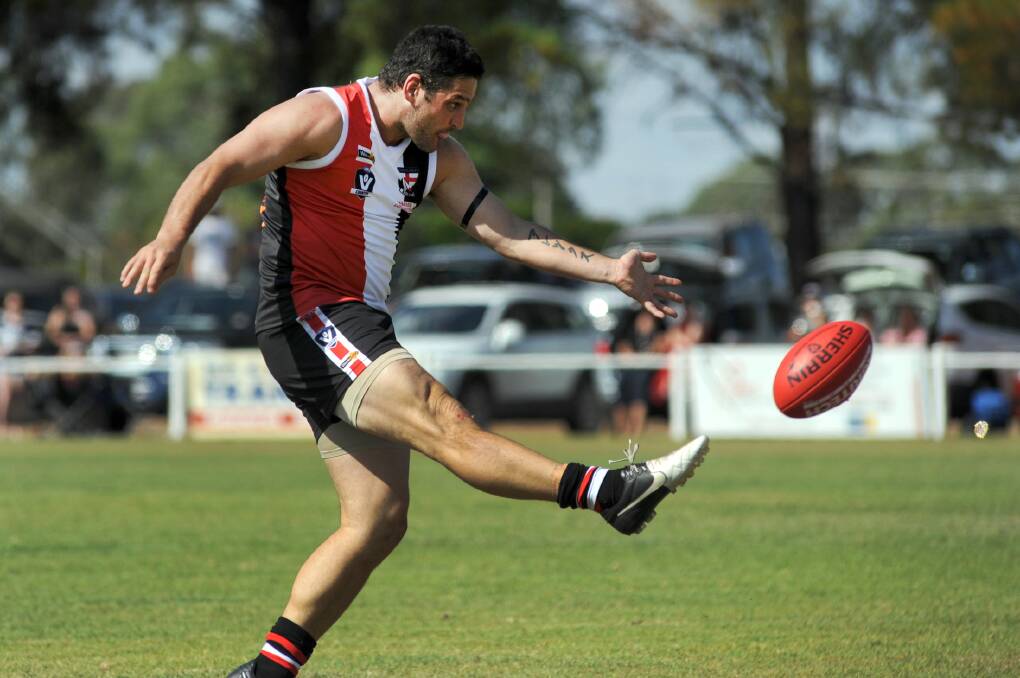 Brendan Fevola booting one of his 12 goals for Edenhope-Apsley in round one, 2012.
