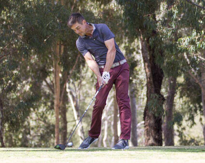 Adam Tribe tees off. Picture: PETER PICKERING