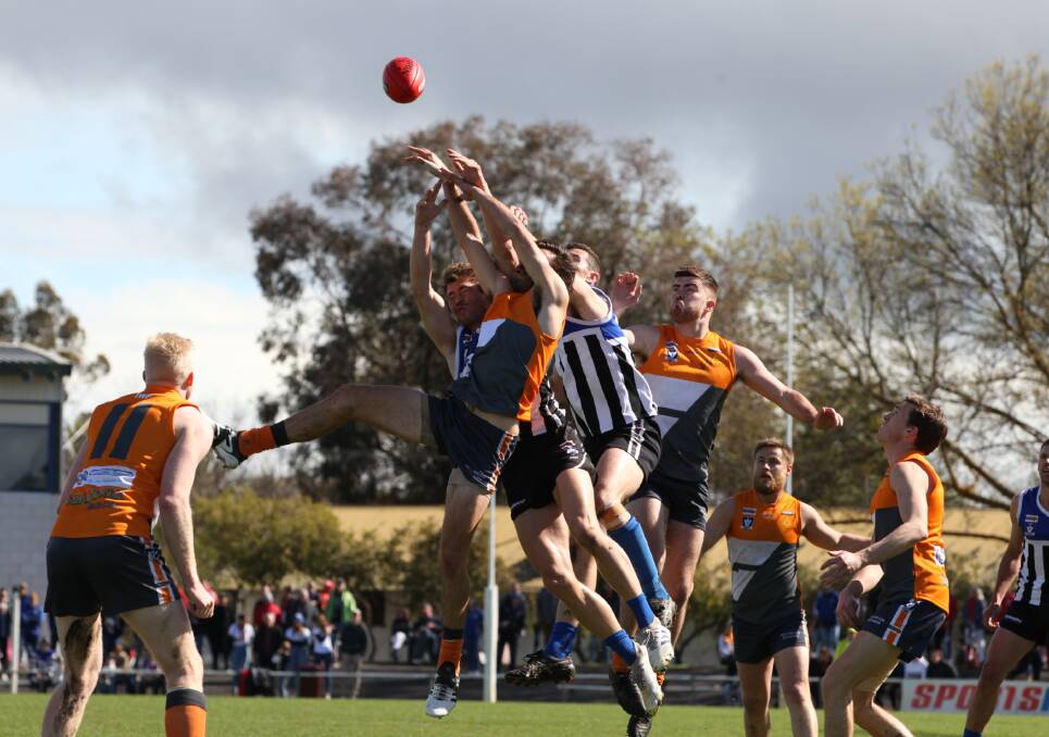 Players from Minyip-Murtoa and the Southern Mallee Giants fly during the 2019 Wimmera Football League grand final. Picture: PETER PICKERING