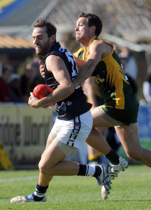 Scott Carey lays a tackle, playing with the HDFL interleague side in 2015.