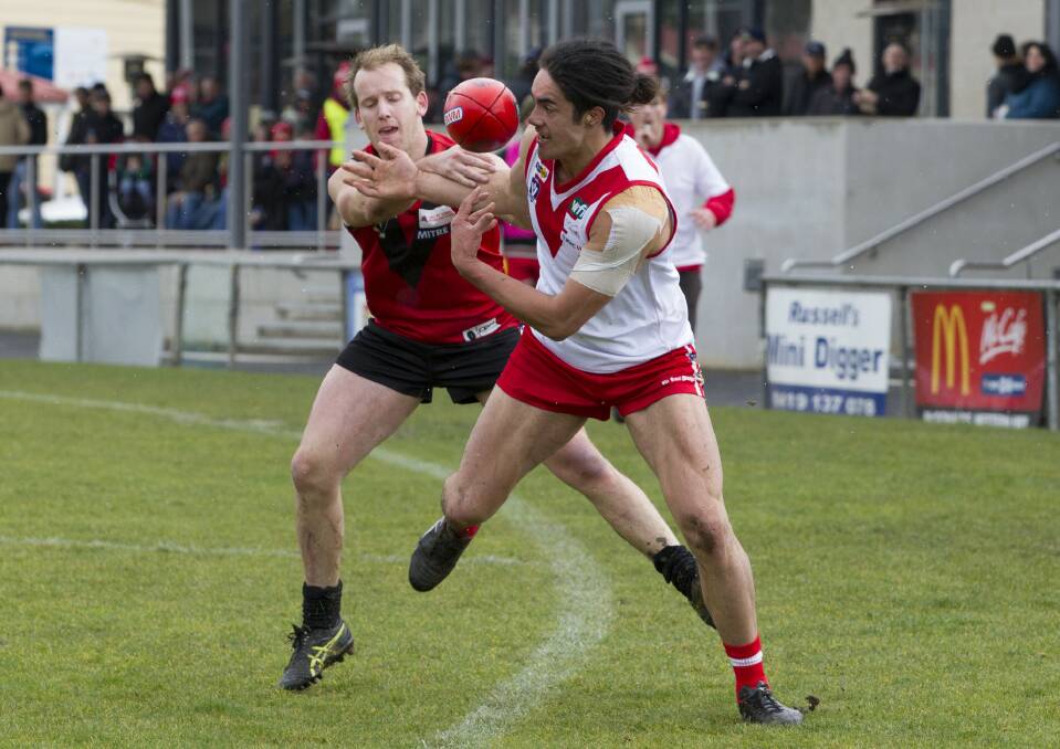 CONTEST: Stawell Warrior Cam Kimber and Ararat Rats' Jayden Wright battle for possesion on the boundary line last season. Picture: PETER PICKERING