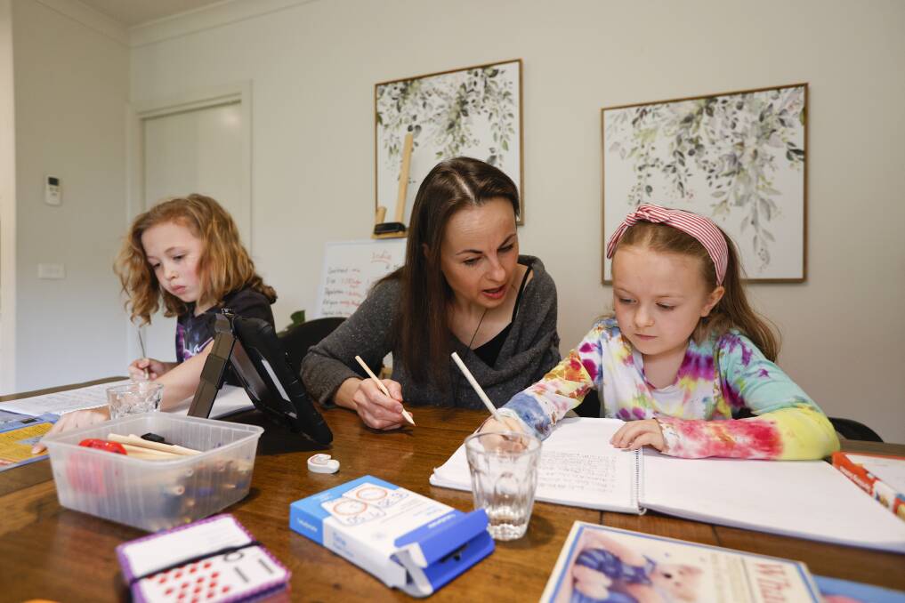LEARNING: Nine-year-old Bailey, mum Marky Kalla and six-year-old Eiley are spending more time together doing school from home. 