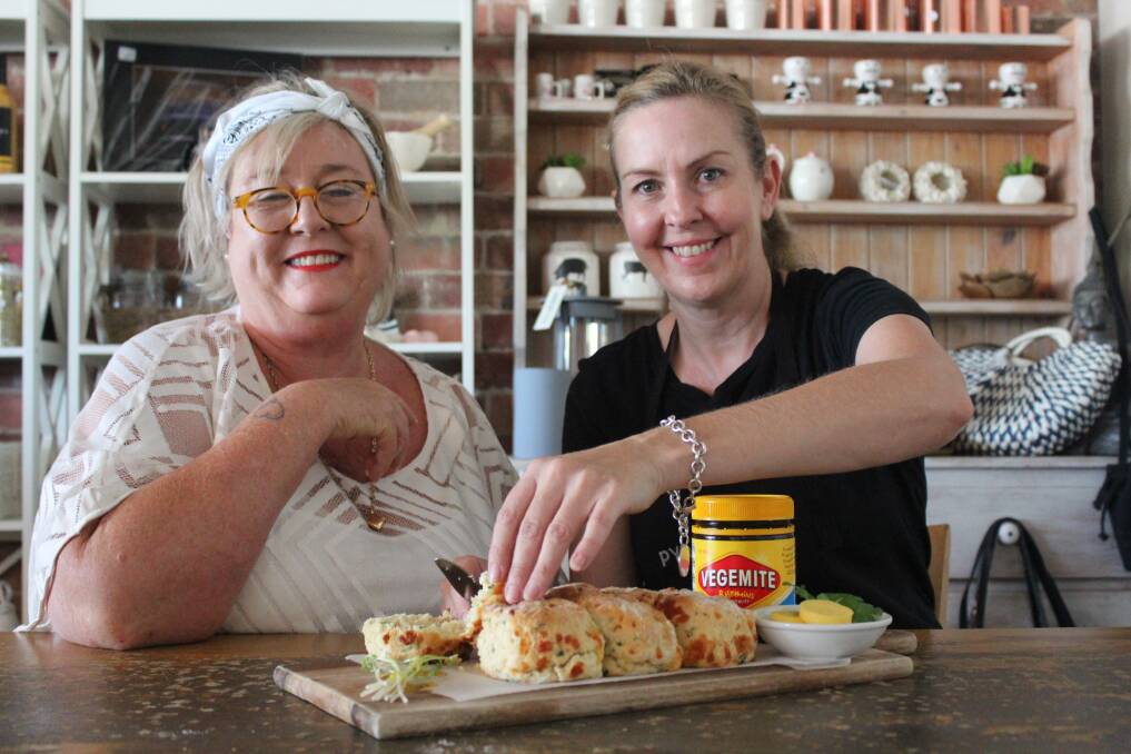TASTE: Beaufort cafes served Vegemite specials on the Australia Day weekend. Beaufort Progress Association president Liza Robinson and Pyrenees Pantry owner Samantha Thayer try a vegemite, cheese and parsley scone. Picture: Rochelle Kirkham