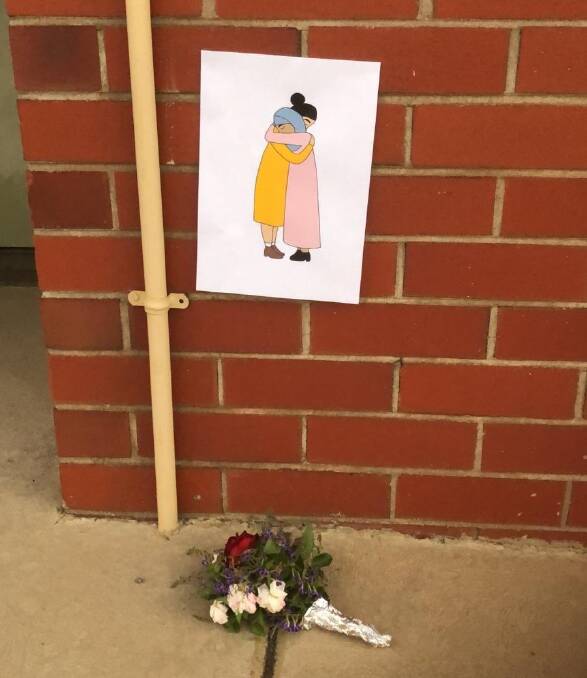 The picture and flowers left at the Ararat Islamic Welfare Association centre.
