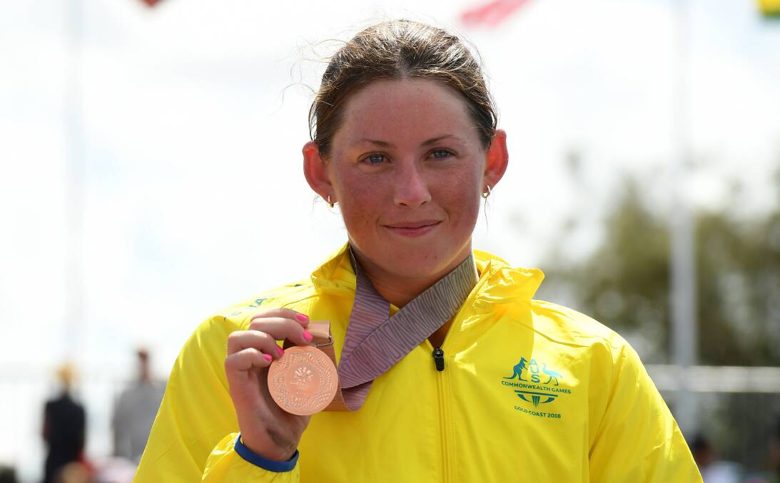Lauren Parker with her women's paratriathlon bronze medal at the Commonwealth Games, held on the Gold Coast in April. Picture: Dean Lewins/AAP