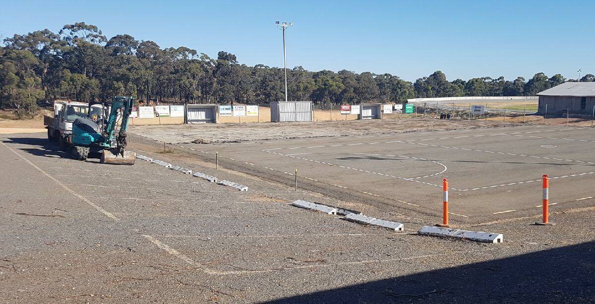 UNDERWAY: Work has begun to resurface the netball courts at St Arnaud Netball Club. They will be done in time for the 2018 season. Picture: CONTRIBUTED