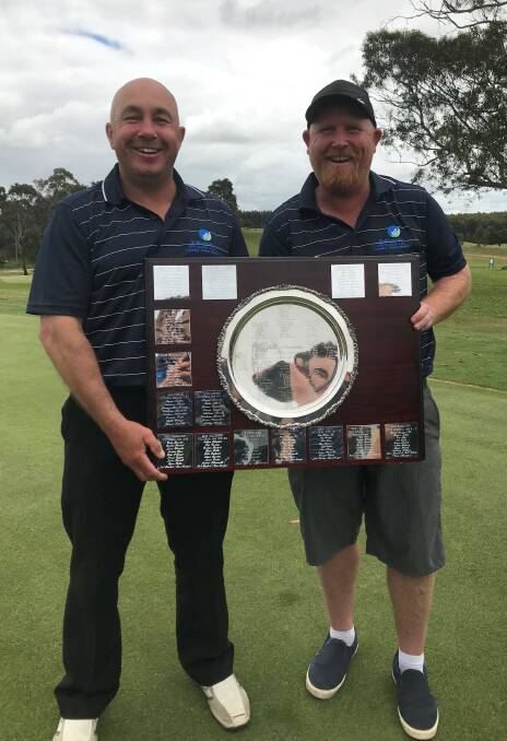 Shane Grover and Tim Coffey with the shield after Victoria Country defeated South Australia.