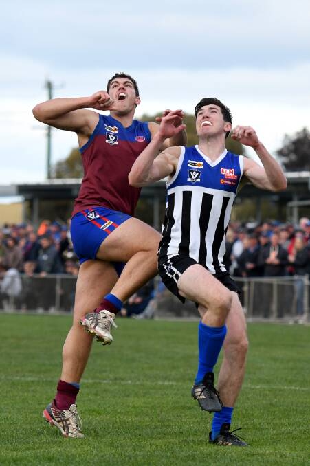 Billy Carberry for Horsham jumps for the ball against Minyip-Murtoa's Kieran Delahunty in last season's second semi-final. Picture: SAMANTHA CAMARRI