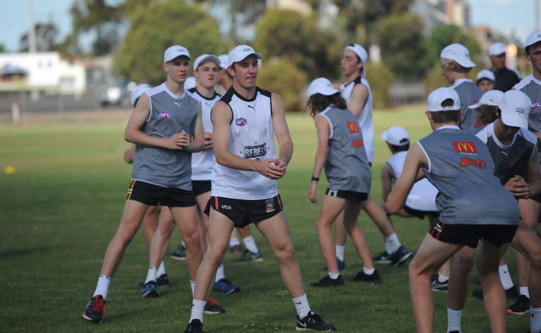 PUTTING IN THE HARD YARDS: The Wimmera Rebels training group at Dimboola Road Oval in November. The group has been training in some hot conditions lately. 