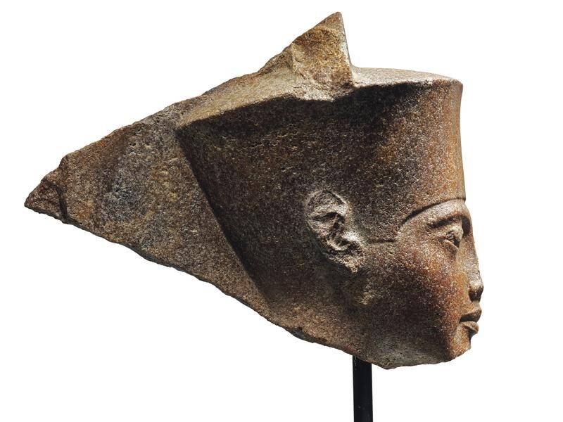 A rare sculpture depicting the boy pharaoh Tutankhamun has been sold for $A8.4 million at auction.