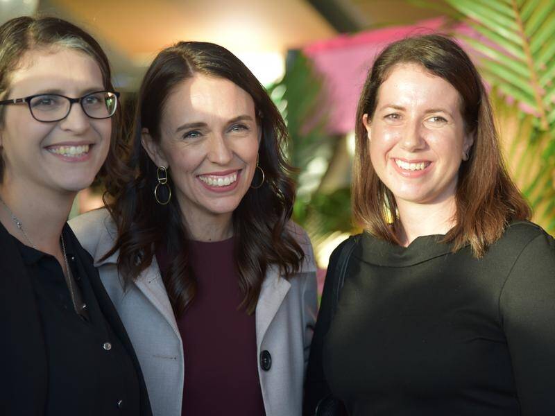 NZ PM Jacinda Ardern (centre) at Wellington Airport on the first day of the trans-Tasman bubble.