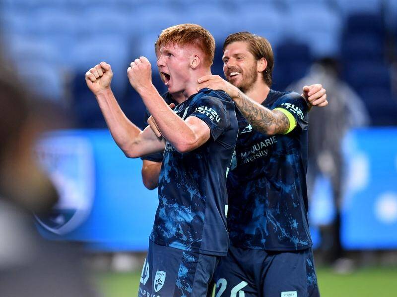 Mitch Glasson celebrates his part in Sydney FC's final goal in the 3-2 win over Perth Glory. (Bianca De Marchi/AAP PHOTOS)