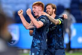 Mitch Glasson celebrates his part in Sydney FC's final goal in the 3-2 win over Perth Glory. (Bianca De Marchi/AAP PHOTOS)