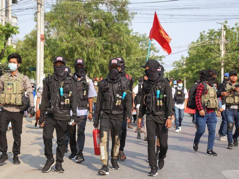 Myanmar's rulers say protesters, some carrying home made weapons, killed 22 soldiers and police.
