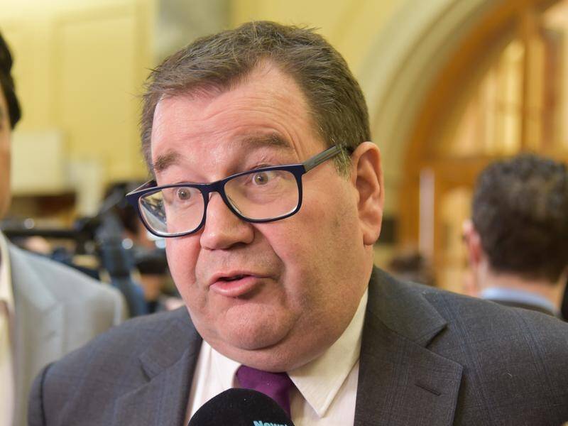 NZ Finance Minister Grant Robertson says the pay policy was intended to show "restraint".