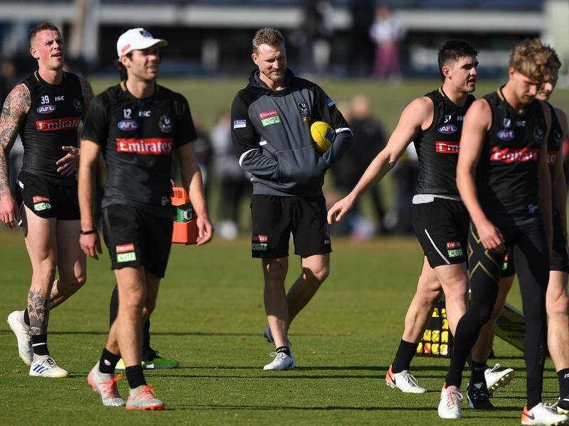 Magpies coach Nathan Buckley (c) has defended his side's form ahead of facing Richmond.