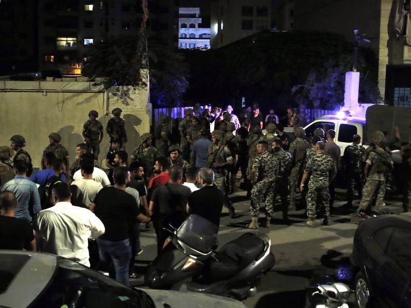 Lebanese troops at the site where an Israeli drone was said to have crashed in Beirut.