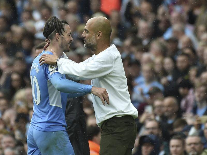 Jack Grealish being hailed by manager Pep Guardiola after his goalscoring display for Man City.